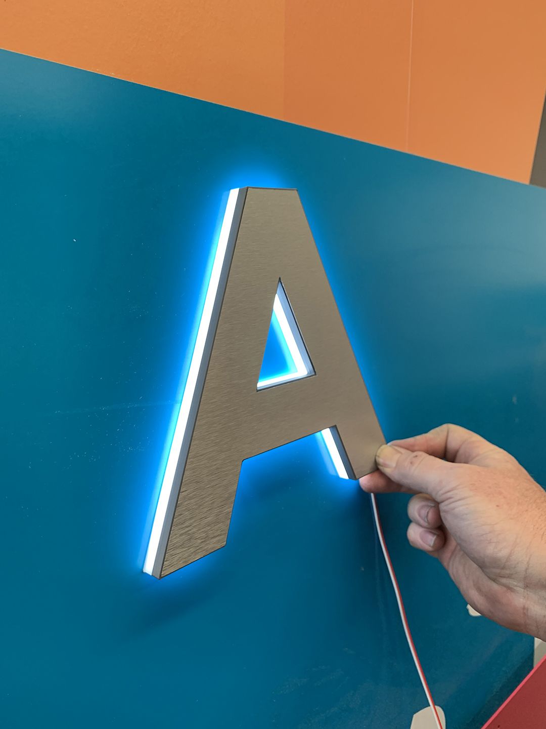 Halo lit 3D printed letter with brushed aluminium face